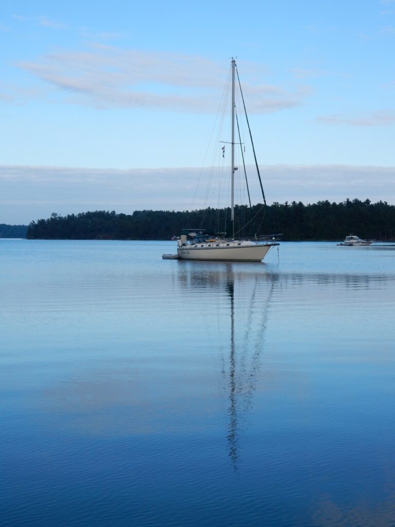 sailboat in lake sunset