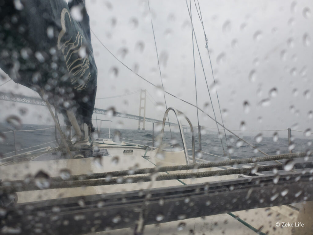 sailing under Mackinac Bridge