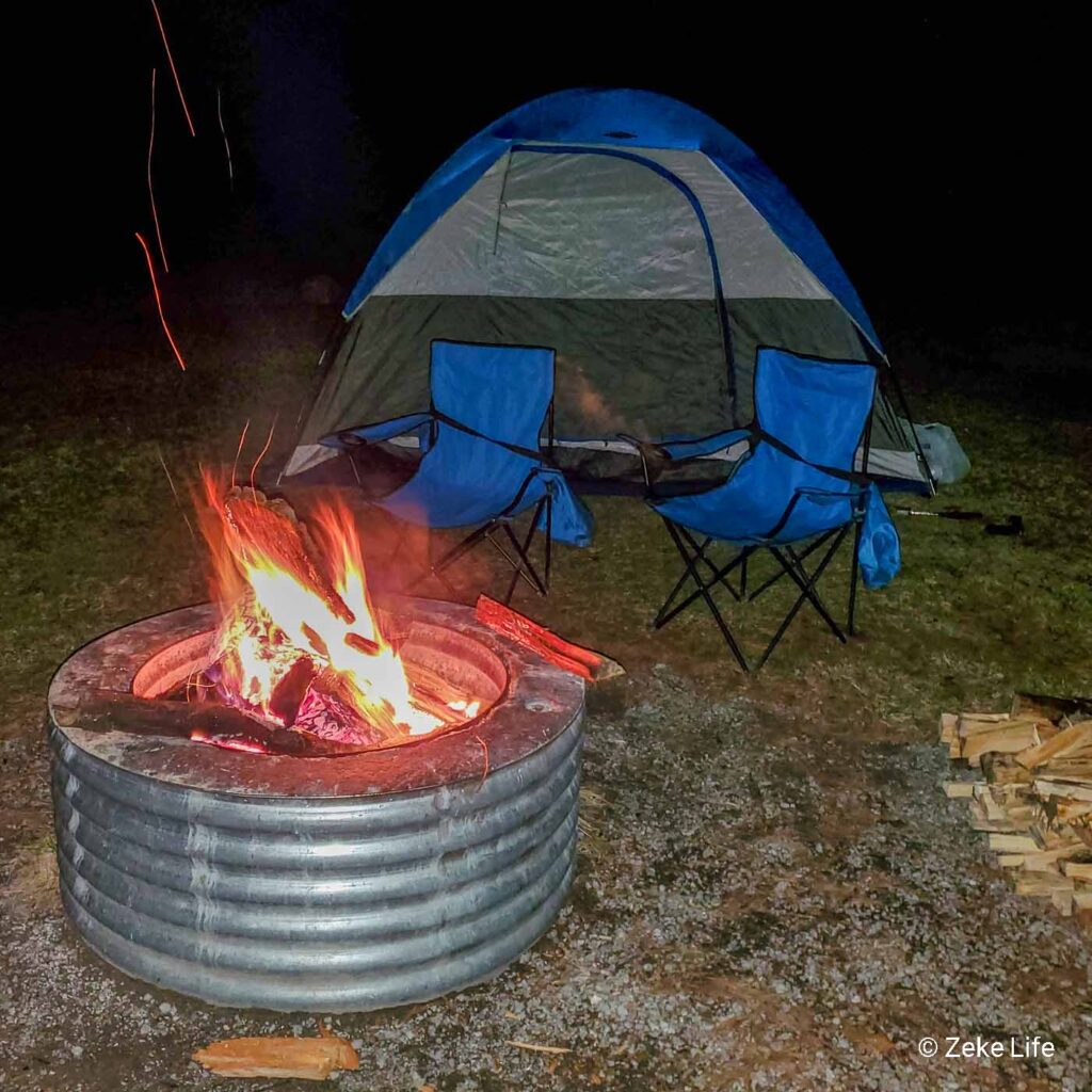 tent with chairs and fire