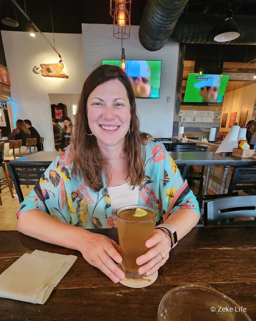 kara with beer at bone hook brewing co