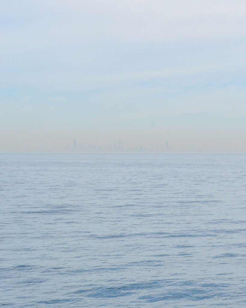 very faint Chicago skyline in the distance of Lake Michigan