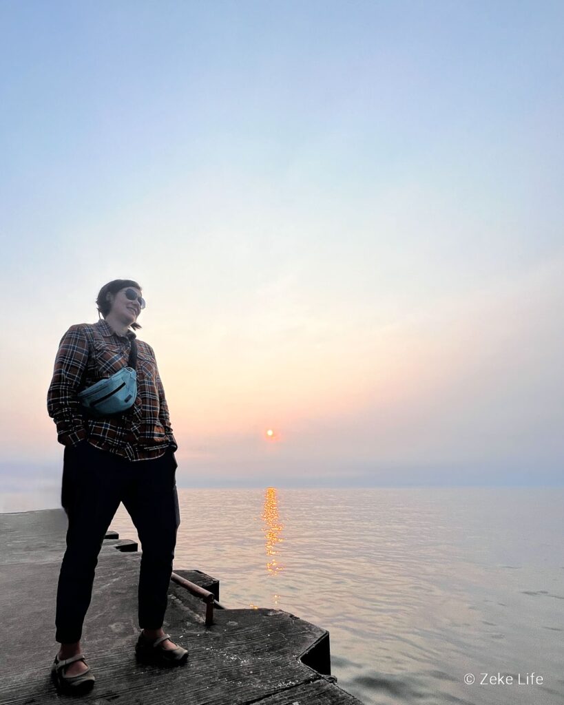 Kara with sunset over Lake Michigan