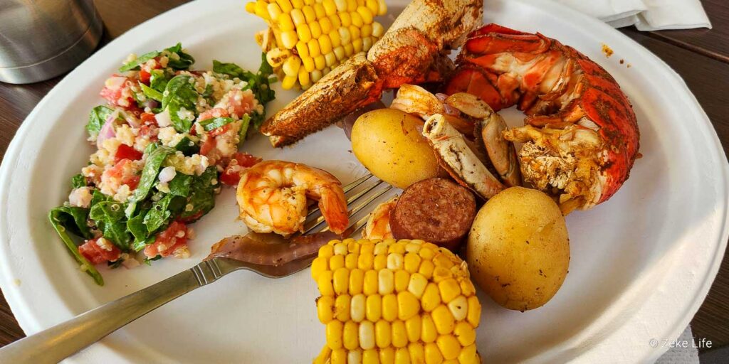 plate of seafood boil with salad