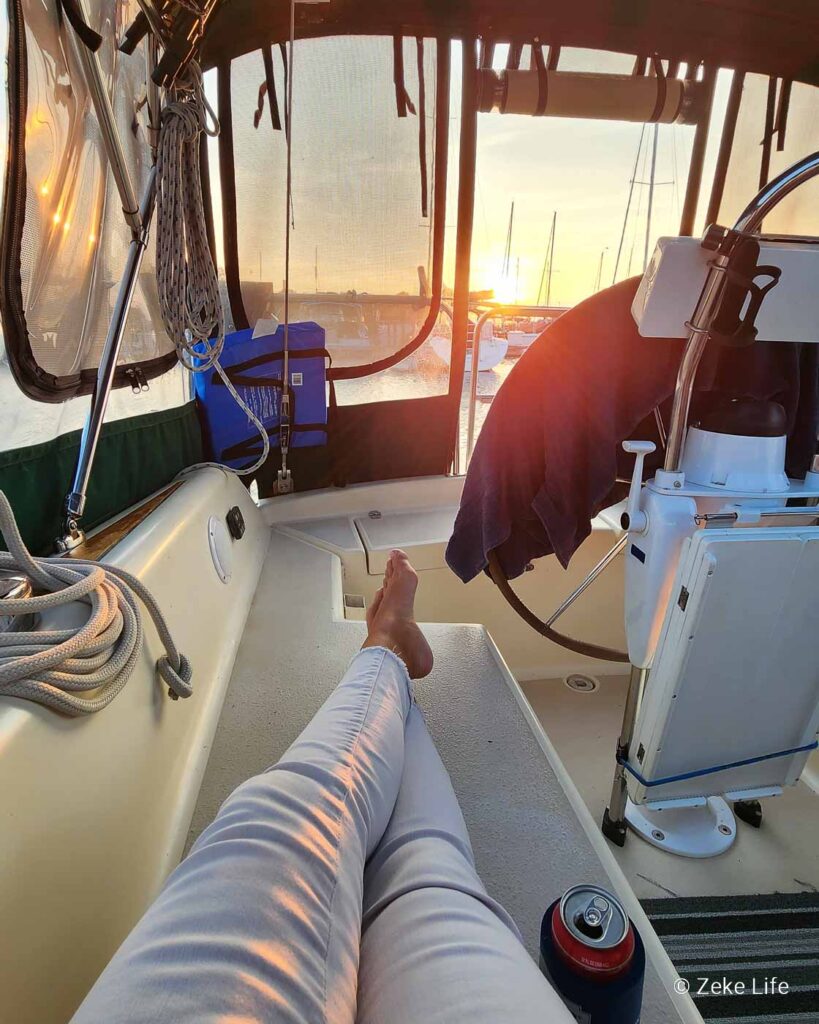 Kara's legs on deck watching sunset